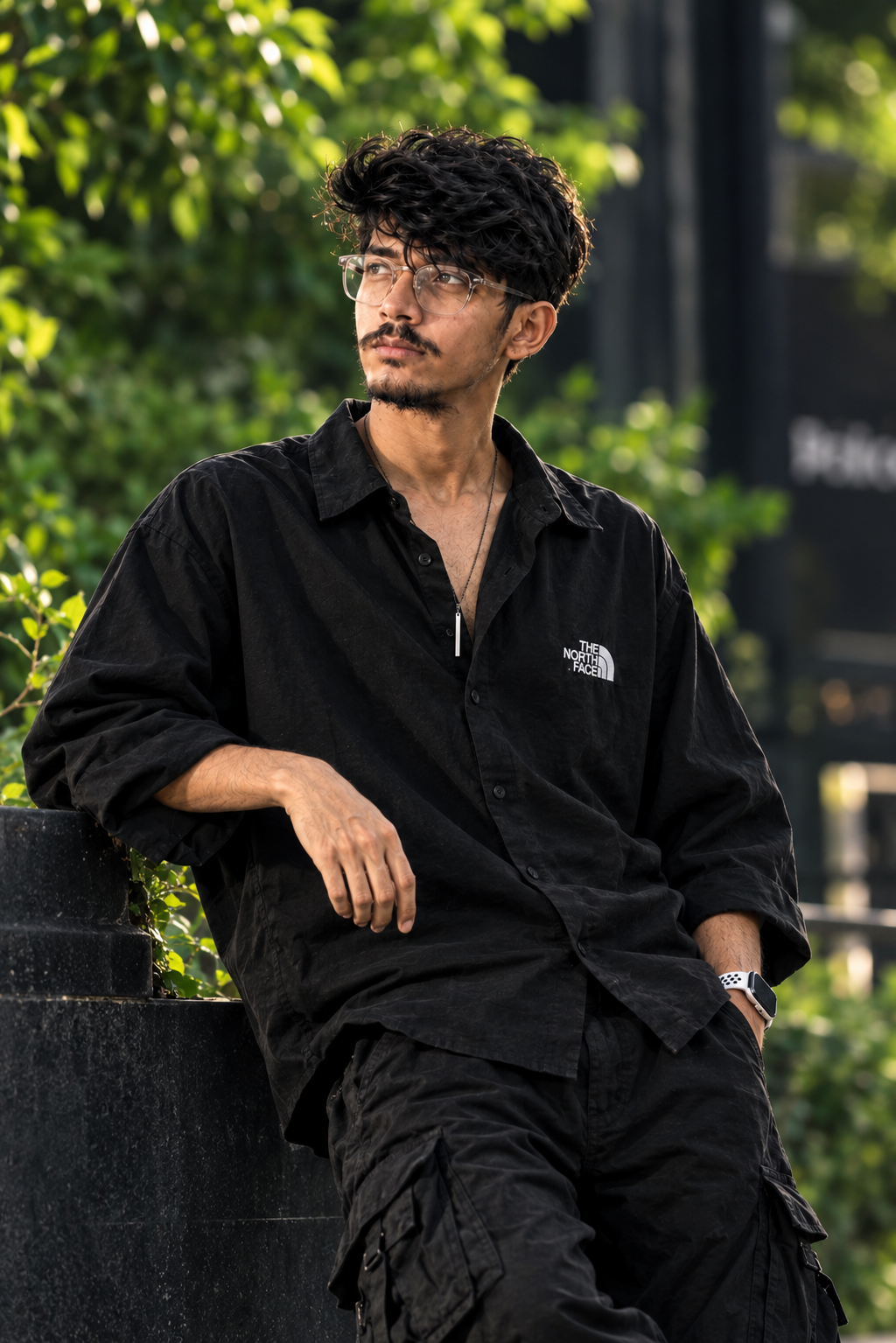 ULTRA-REALISTIC CREATE IMAGE. A STYLISH YOUNG MAN WITH MESSY VOLUME HAIR, ATTITUDE POSING OUTDOORS IN A VIBRANT NATURAL SETTING.